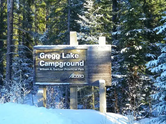 Entrance sign of the Gregg Lake Campground area (winter).